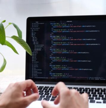 How to Build Your Own App person using macbook pro on white table