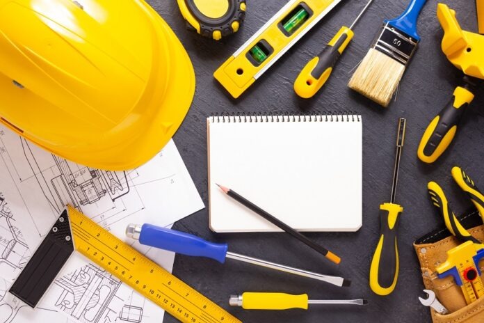 Construction tools at black background. Tool for house renovatio
