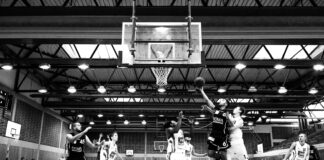 Playing Basketball like a Pro: A Comprehensive Guide grayscale basketball players