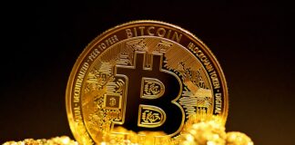 Antminer S9: Is it still profitable to mine Bitcoin in 2023? a bitcoin sitting on top of a pile of gold nuggets