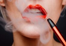 Why Should You Use Disposable THC Vape In Your Daily Life? woman with red lipstick and red lipstick