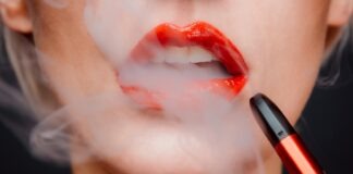 Why Should You Use Disposable THC Vape In Your Daily Life? woman with red lipstick and red lipstick