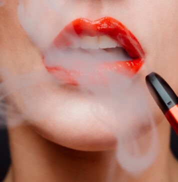 Why Should You Use Disposable THC Vape In Your Daily Life? woman with red lipstick and red lipstick