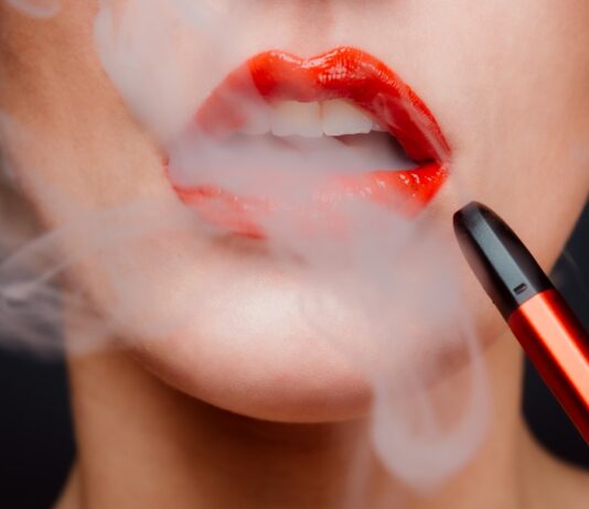 Why Should You Use Disposable THC Vape In Your Daily Life? woman with red lipstick and red lipstick