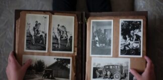 Album Design Upgrades Your Clients Will Love person opening photo album displaying grayscale photos