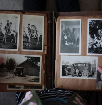 Album Design Upgrades Your Clients Will Love person opening photo album displaying grayscale photos