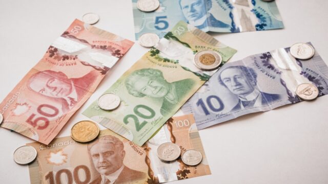 Photo by PiggyBank a bunch of money sitting on top of a table