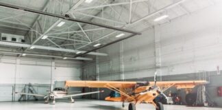 Things You Should Know about Steel Airplane Hangars orange biplane