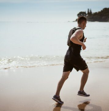 Preventive Healthcare After 50: 6 Unhealthy Habits You Should Drop Free Man Wearing Black Tank Top and Running on Seashore Stock Photo
