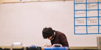 Want To Go to Med School? Here’s What You Need To Do man in brown sweater sitting on chair