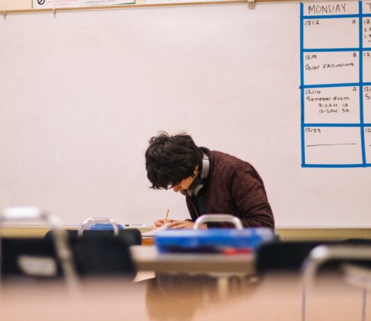 Want To Go to Med School? Here’s What You Need To Do man in brown sweater sitting on chair