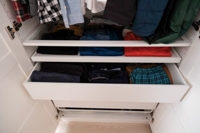 Photo by Kamil Kalkan a closet full of clothes