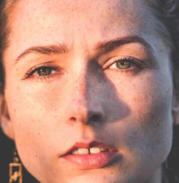 A Comprehensive Guide: How to Remove Wrinkles from Photos Easily sun rays of woman's face