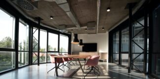 What should the office interior comply with? photo of dining table and chairs inside room