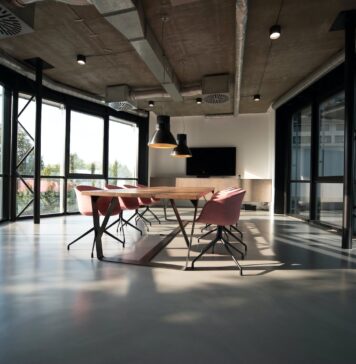 What should the office interior comply with? photo of dining table and chairs inside room