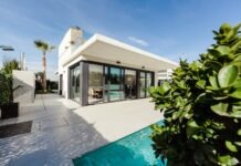 How to Create an Aesthetically Pleasing New Build Home white and grey concrete building near swimming pool under clear sky during daytime