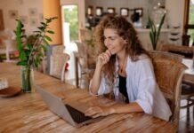 Responsible Gambling: A Friendly Guide Woman in White Dress Shirt Using Laptop Computer