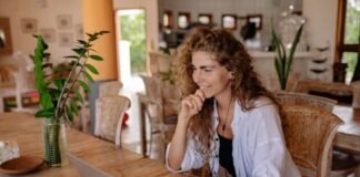 Responsible Gambling: A Friendly Guide Woman in White Dress Shirt Using Laptop Computer