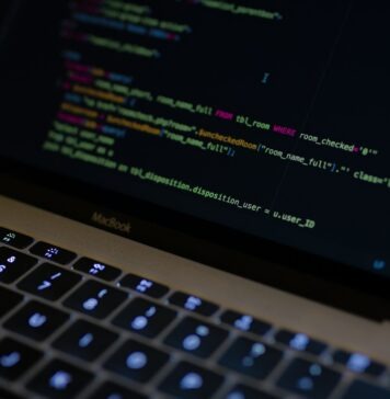 Maximize Sales: Why Python is a Game-Changer for E-commerce Website Development MacBook Pro with images of computer language codes