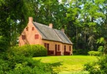 How To Avoid Legal Fees When Selling Your Home brown brick house surrounded by green trees during daytime