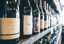 Wine Bottle: The Vessel of Elegance and Joy organized bottles on shelf