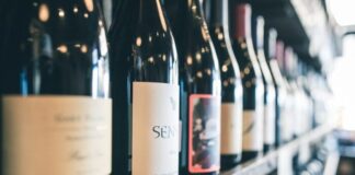 Wine Bottle: The Vessel of Elegance and Joy organized bottles on shelf