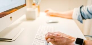 Increasing Your Online Presence and Safely Buying Website Traffic person using iMac