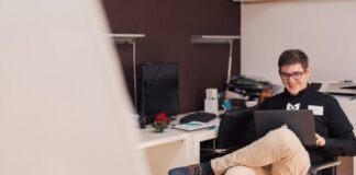 Winning Strategies for Online Casino Games: Tips from the Experts man smiling while sitting and using MacBook