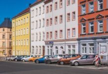 Dumpster Rental Tips For Landlords And Property Managers In Chicago assorted-color cars parked beside apartments