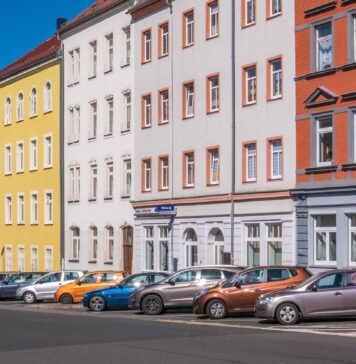 Dumpster Rental Tips For Landlords And Property Managers In Chicago assorted-color cars parked beside apartments