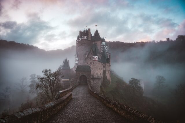 Photo by Cederic Vandenberghe closeup photo of castle with mist