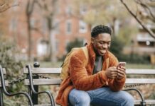 Demystifying Betting Terms: From Ante to Zig-Zag Delightful African American man surfing modern cellphone in city park