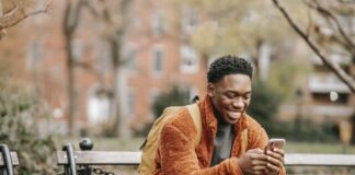 Demystifying Betting Terms: From Ante to Zig-Zag Delightful African American man surfing modern cellphone in city park