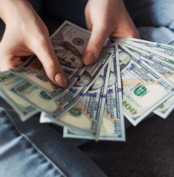 Mastering Bike Loan Interest Rates: Your Path to Financial Freedom fan of 100 U.S. dollar banknotes
