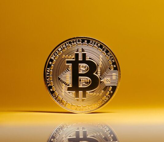 Getting Started: Acquiring Crypto for Online Gambling Bitcoin on Yellow Studio Background