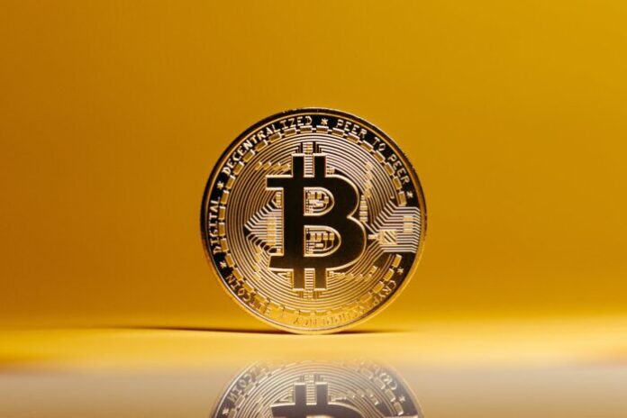 Photo by Jonathan Borba Bitcoin on Yellow Studio Background