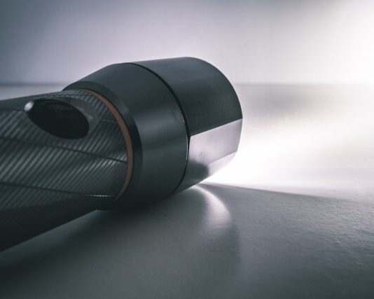 How Does the Small Tactical Flashlight Enhance Personal Security? Black Flashlight Turned On