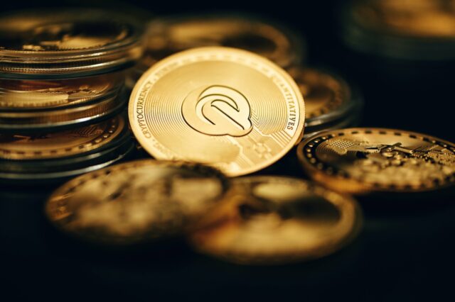 Photo by Traxer a close up of a coin on a table