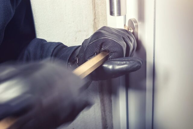 free-person-opening-a-door-with-a-bar-stock-photo Free Person Opening a Door with a Bar Stock Photo