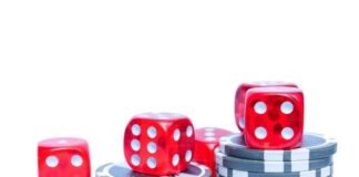 Empowering Players: Mega888’s Stance on Responsible Gambling in Malaysia 3 Red Dices With Grey and White Poker Chips