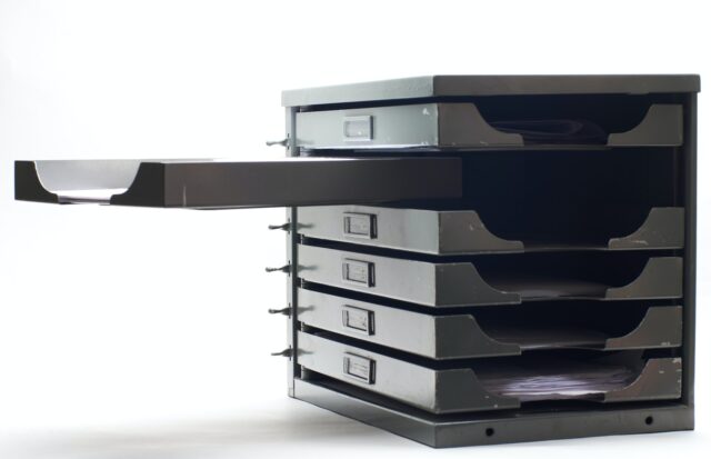 Photo by Gianluca Cinnante a stack of drawers sitting on top of each other