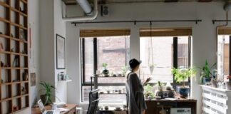 The Top Ways To Add More Space To Your Home For Your Family In Australia woman standing near brown wooden cabinet