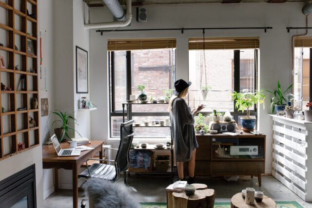 Photo by Bench Accounting woman standing near brown wooden cabinet