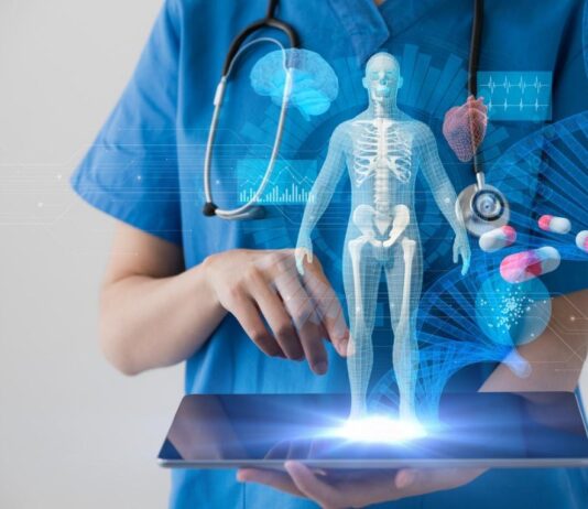 The nursing response to the genetics revolution A person holding a tablet with a skeleton Description automatically generated