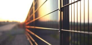 Which Fence Is Right for You? black metal fence during sunset