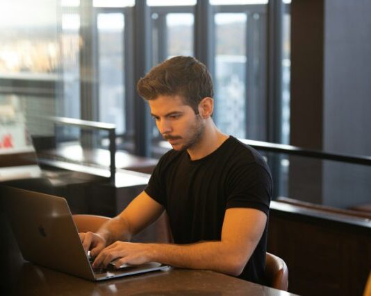 How to use odds in Aviator Game man in black crew neck t-shirt using macbook