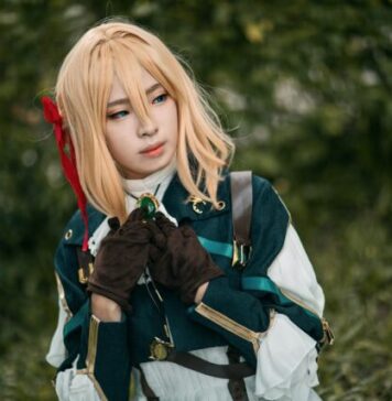 Everything New Cosplayers Need to Know woman in blue and white jacket holding black short coated dog