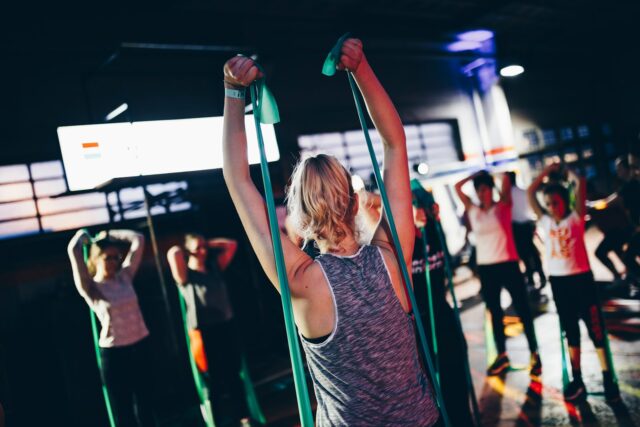 Photo by Geert Pieters group of people in gym while exercising