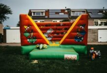 Transforming Events with Giant Inflatable Slides: A Fun-Filled Attraction for All Ages a large inflatable bouncer in a yard