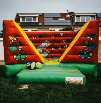 Transforming Events with Giant Inflatable Slides: A Fun-Filled Attraction for All Ages a large inflatable bouncer in a yard